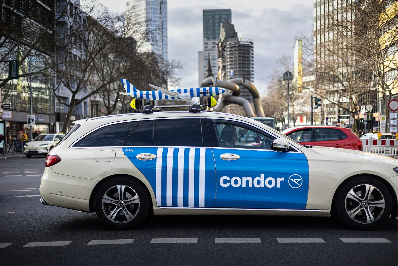 Condor full-wrap taxi on Tauentzienstrasse in front of the Kaiser Wilhelm Memorial Church