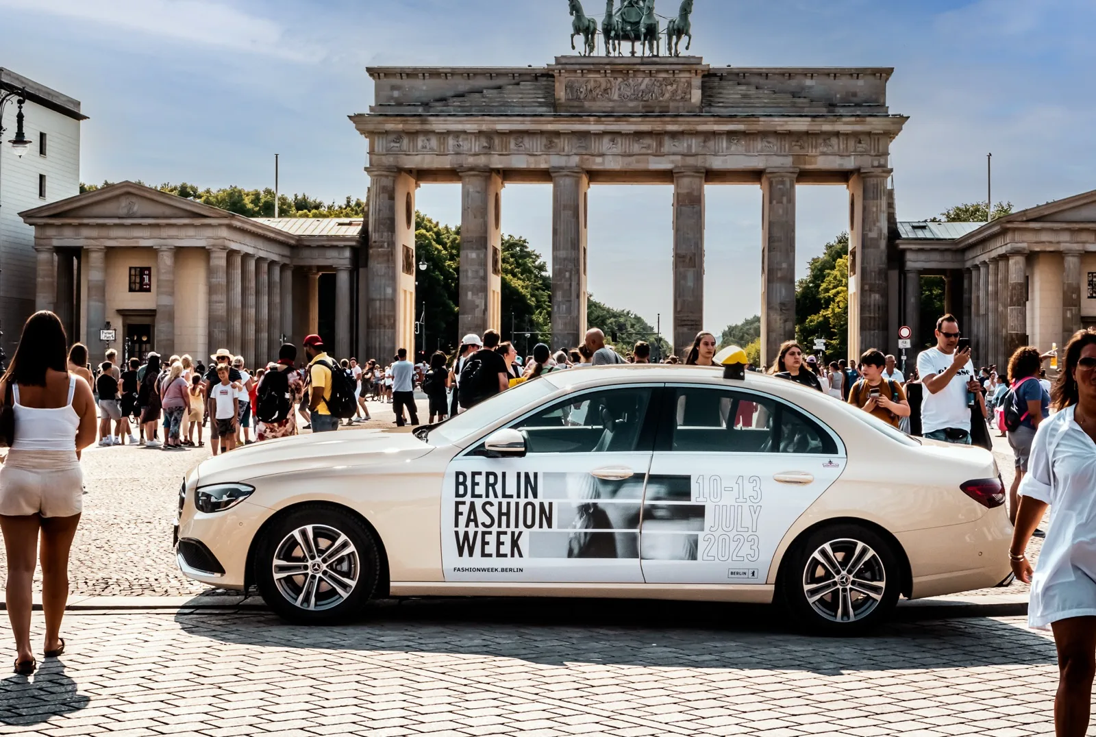 Berlin Fashion Week taxi advertising in front of the Brandenburg Gate